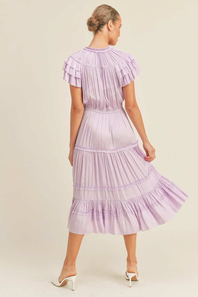 Lavender midi ruffle dress with flutter sleeves and string tie neck closure